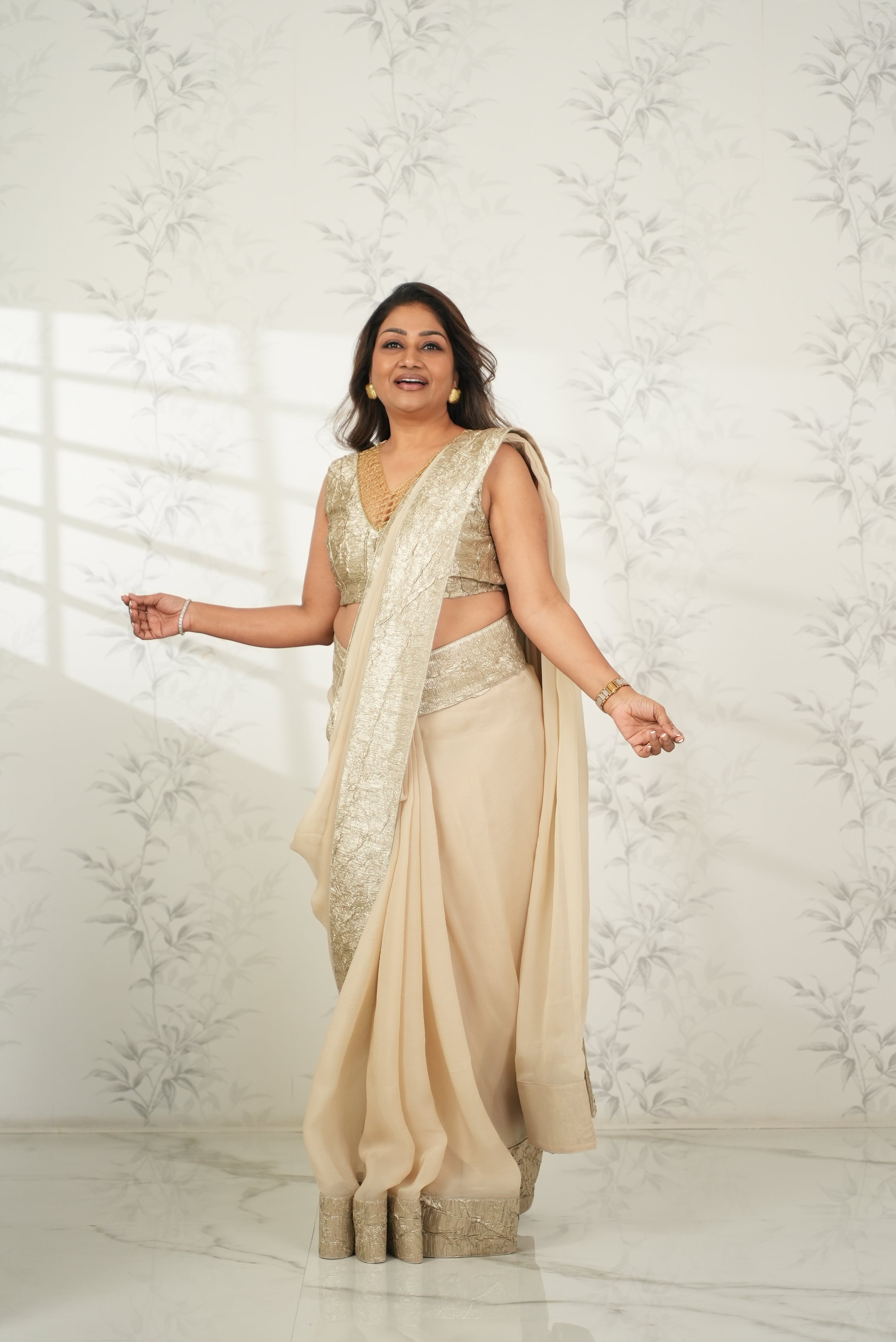 DOLLY JAIN IN CRUSHED-GOLD PRE-STICHED DRAPE SAREE