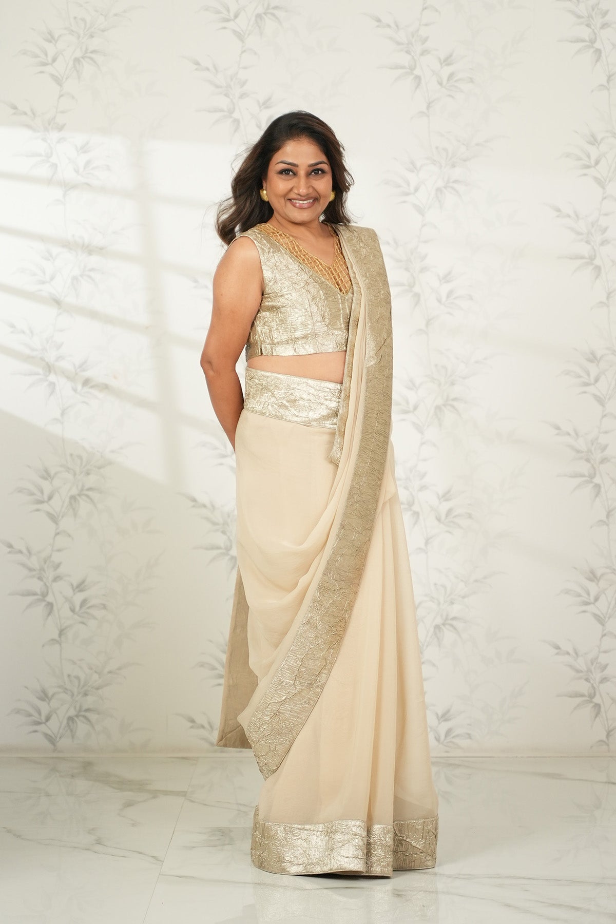 DOLLY JAIN IN CRUSHED-GOLD PRE-STICHED DRAPE SAREE