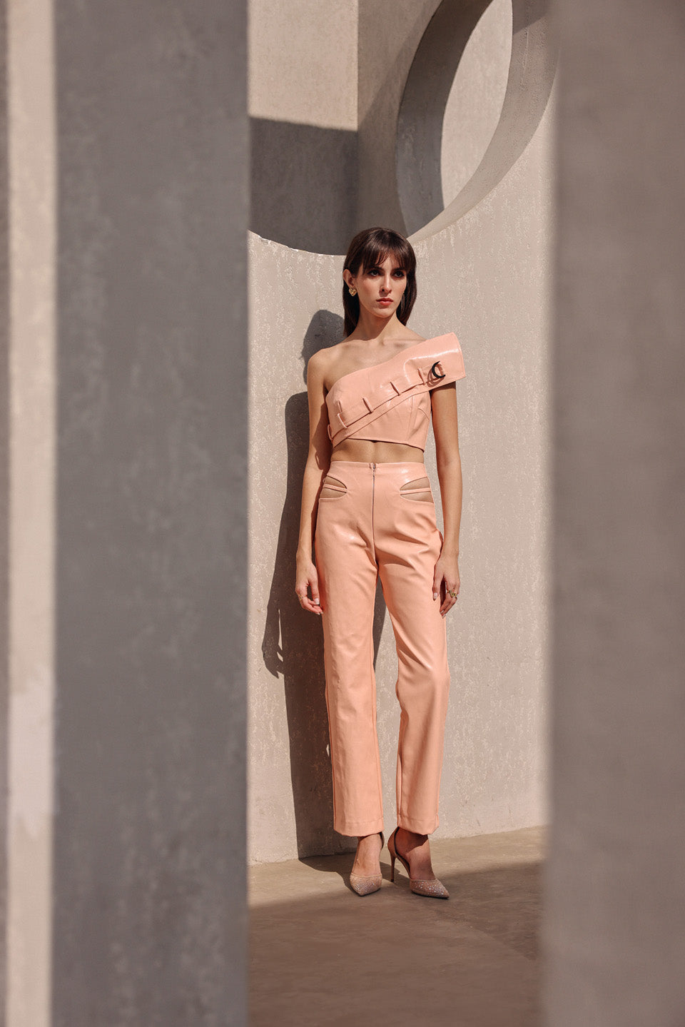 Peach leather cut out pants with edgy bustier
