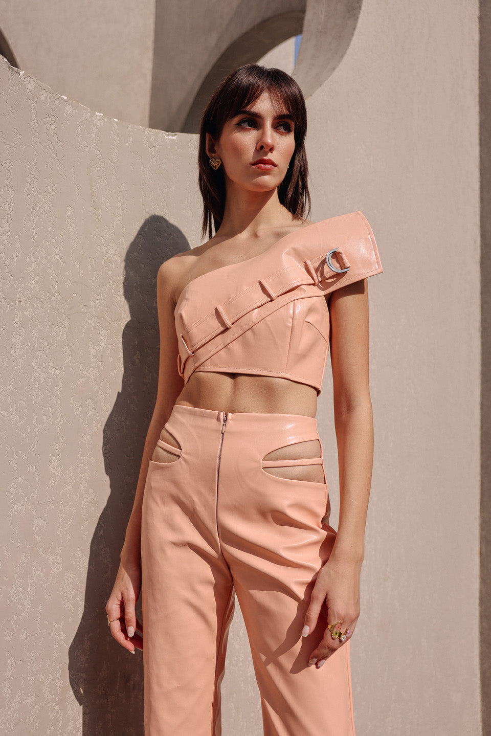 Peach leather cut out pants with edgy bustier