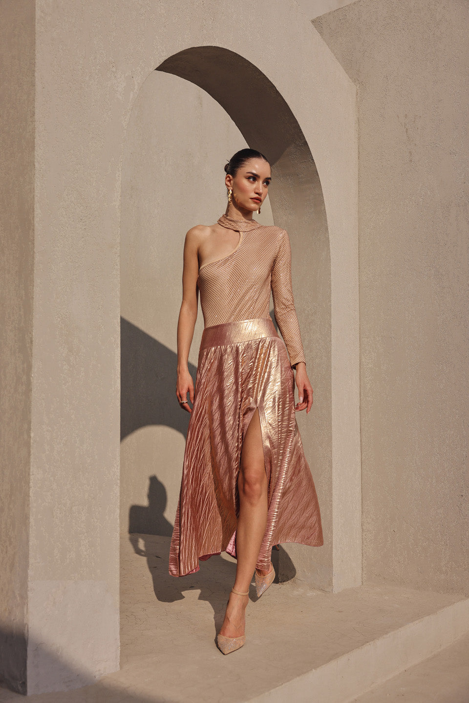 Rose gold rhinestone body suit with pleated slit skirt