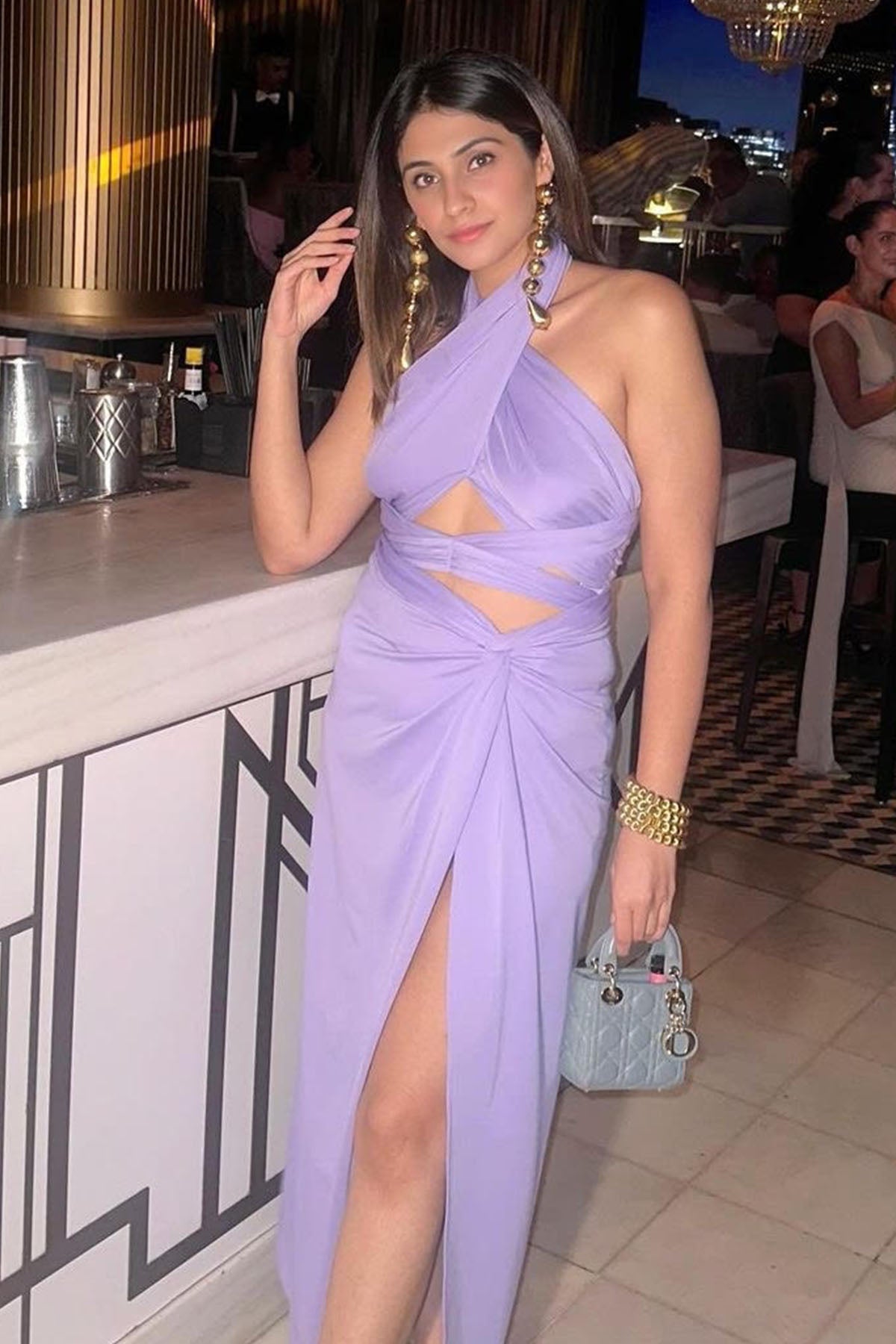 Hena Malhotra in Lilac Knotted Slit Skirt with Cross Kat Top