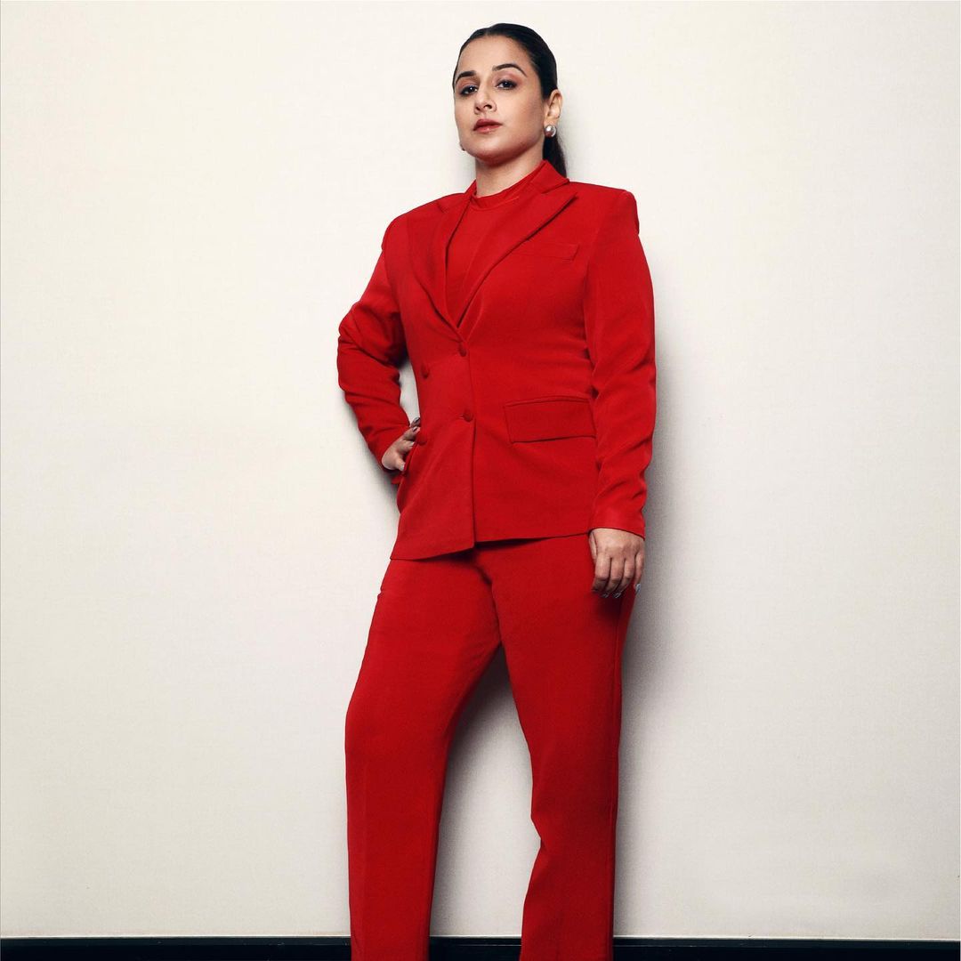 Spot style red power suit with high neck top - Vidya balan