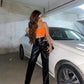Cut out leather pants with neon strap top